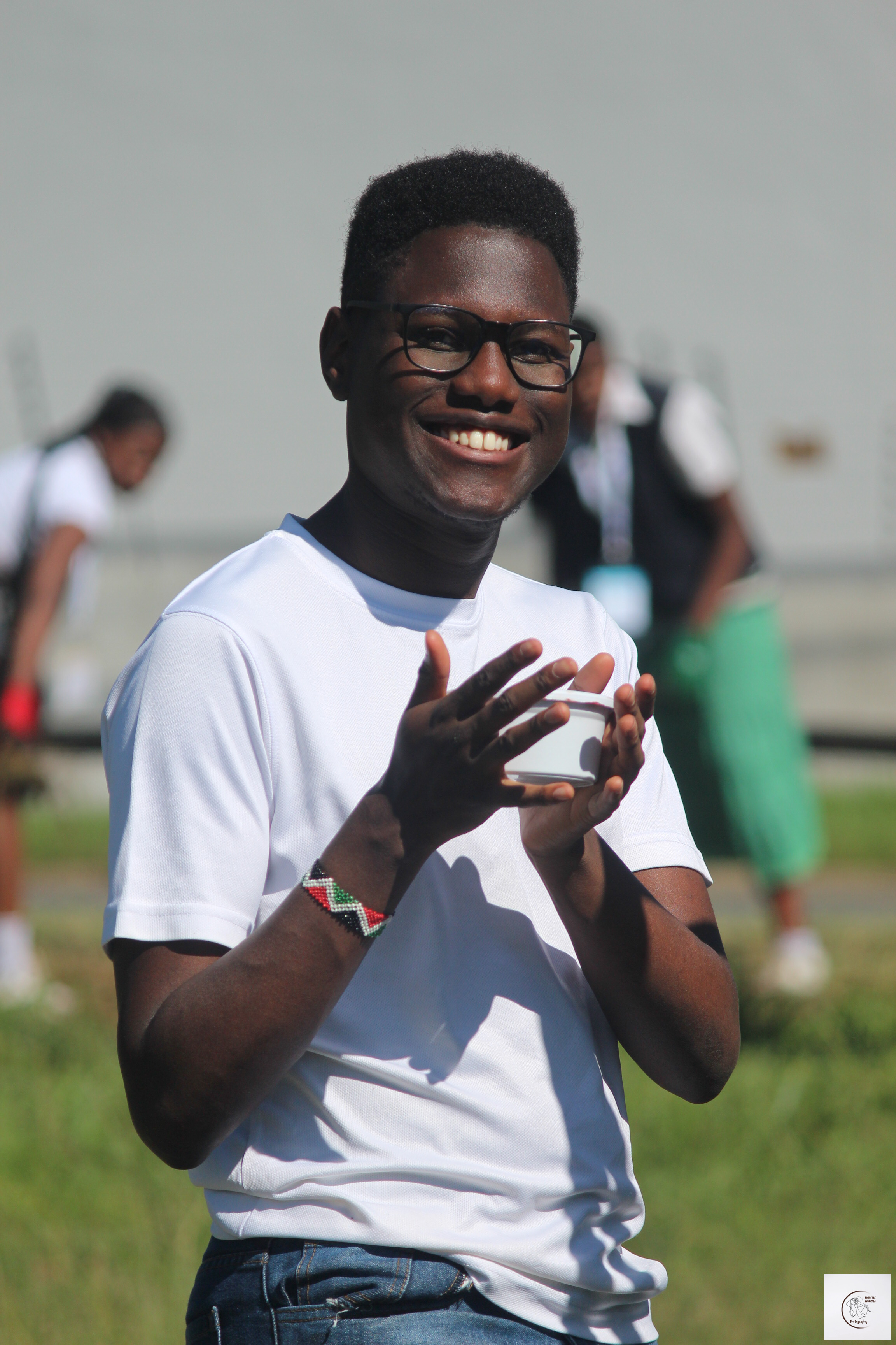 Thayu Wainaina taking part in a community environmental activity